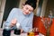 Young millennial woman dying Easter eggs in vintage kitchen