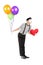 Young mime artist with balloons and red heart giving kisses