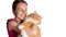 Young mistress hugs her ginger cat. Portrait of woman holds red cat in her hands isolated on white. Pet care concept. Girl is
