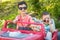 Young Mixed Race Chinese and Caucasian Brothers Wearing Sunglasses Playing In Toy Car