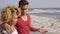 Young Mixed-Race Couple Standing On The Beach