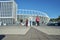 Young mixed racial athletes running on stadium background