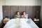 Young mobile couple lying in bed while using their smartphones