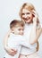 Young modern blond curly mother with cute son together happy smiling family posing cheerful on white background