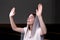 A young modest girl with a handkerchief on her head is sitting in church and praying. The concept of religion, prayer, worship