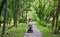 Young mom walks with a stroller