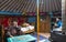 Young mongolian nomad family in their home ger yurt