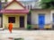 Young monk walking home in Chiang Mai Thailand.