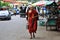 Young monk walking in Yangon with offering lunch