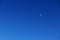 Young moon in the blue sky without clouds in the style of minimalism