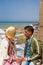 Young Moroccan couple sitting at the old fort of Essaouira