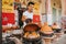 Young moroccan man cooking tajines in Morocco.