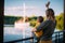 Young mother with cool kid boy stand on dock, look at sailboat. Back view. Summer photography about family and travel