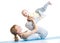 Young mother does fitness exercises together with baby boy isolated
