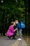 Young mother embraces her excited first class son on the way to school. Ready to study