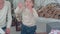 Young mother and excited boy counting Christmas presents on his fingers