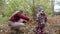 Young mother and her little daughter walk in autumn park.