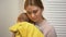 Young mother holding adorable baby in arms, artificial feeding, newborn care