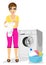 Young mother holding baby vest standing next to washing machine