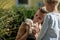 Young mother holding furry cute baby pet rabbit