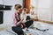 Young Mother Playing Toys with Baby on Carpet