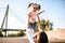 Young mother raises her daughter high up with her hands