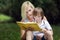 Young Mother Reading English Book to Son