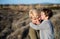 Young mother with small daughter in mediterranean nature, kissing.