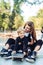 Young mother teaches her little boy to ride a skateboard