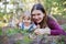 Young mother and toddler girl lying on the ground