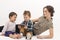 Young mother with two children watching cartoons on cell phone