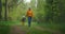 A young mother walks together in the Park with a child holding his hand. Walking together in the woods. Motherhood and