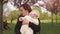 Young mother woman enjoying free time with her baby boy child - Caucasian white child with a parent`s hand visible -