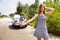 Young multiethnic international couple traveling on the car in sunny day