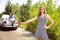 Young multiethnic international couple traveling on the car in sunny day