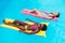 Young multiethnic women floating on inflatable mattresses in swimming pool