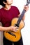 Young multiracial man playing flamenco guitar