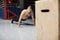 Young muscular athlete doing suspension pushups