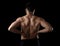 Young muscular body sport man holding sore low back waist with his hands suffering pain