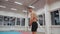 Young muscular man with a naked torso is training in the gym and doing a handstand. Sport and healthy lifestyle concept