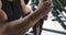 Young musculary man is bandaging arm with bandage in the gym before training. Slow motion