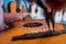 Young musician changing strings on a classical guitar in a guitar shop