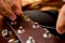 Young musician changing strings on a classical guitar in a guitar shop