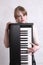 Young musician with her keyboard