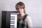 Young musician with her keyboard