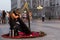 Young musician playing a celtic harp in Madrid