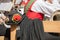 Young musician in typical costume during an autumn local celebration in Val di Funes South Tyrol