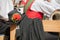 Young musician in typical costume during an autumn local celebration in Val di Funes South Tyrol