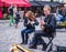 Young musicians play flute and banjo on Montmartre cobblestone street