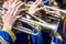 Young musicians plays on trumpets on street concert